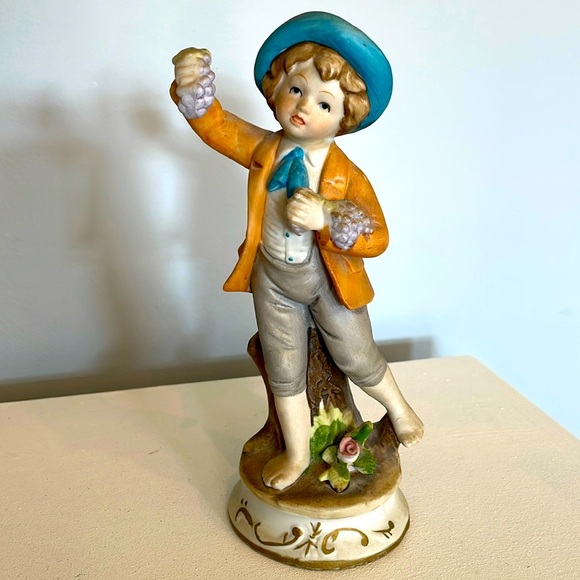 Vintage little boy holding grapes figurine collectible - Picture 1 of 1